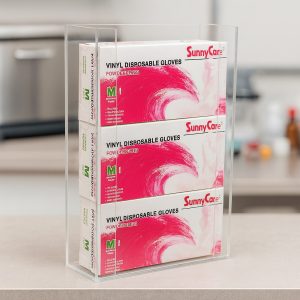 Clear acrylic glove box holder with three boxes, mounted in a doctor's office with side acrylic strips to keep boxes secure